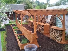 an outdoor garden area with wood and plants