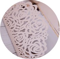 an image of a white lace doily on a piece of paper that is cut in half