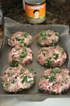 some food that is sitting on a pan and next to a can of beer in the background