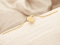 💛 Celebrate love with this beautiful 14K gold heart bracelet, featuring a personalized birthstone to make it truly unique. Crafted from high-quality 14K solid gold, this dainty bracelet is perfect for women who appreciate elegant, minimalist jewelry. The delicate heart charm symbolizes love, while the birthstone adds a personal touch, making it a perfect gift for moms, girlfriends, or anyone special in your life. 💖 ✨ This gold bracelet is adjustable to fit comfortably on any wrist, making it ideal for everyday wear or special occasions. It's a thoughtful and meaningful gift, whether for a birthday, anniversary, Mother's Day, or just because. 🎁 🌟 Features: 14K solid gold for durability and timeless style Customizable with a birthstone of your choice Dainty and minimalist design Perfect Gold Heart Bracelet, Dainty Bracelet, Love Bracelet, Dainty Bracelets, Perfect Gift For Mom, Love Bracelets, Perfect Gift For Her, Gold Heart, Heart Bracelet