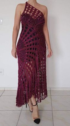 a woman in a purple crochet dress