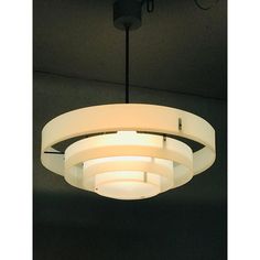 a circular light fixture hanging from the ceiling