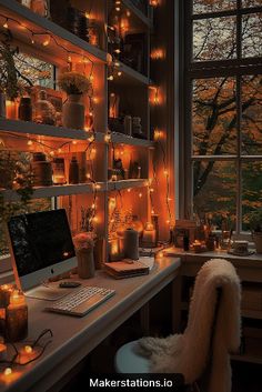 a desk with a computer and lots of lights on the wall above it, in front of a window