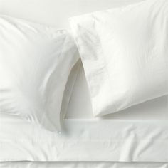 two white pillows on top of each other