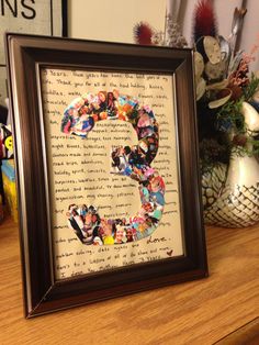 a wooden table topped with a framed photo