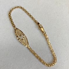 Up for sale is this vintage estate 14 karat solid yellow gold 7" heart cut-out diamond cut ornate filigree 1/8" wide link chain bracelet.  The piece features a diamond cut heart shape cut-out in the center of the filigree center.  The links portion of the bracelet measures approximately 1/8" (3mm) wide.  The bracelet measures 7" long and closes with a lobster claw clasp.  The piece weighs 3.2 grams.  Both end tags are marked 14K ITALY.  Note that some photos are enlarged to show details. Buy wit Gold Filigree Oval Link Jewelry, Heart-shaped Yellow Gold Jewelry With Intricate Design, Heart Shaped Yellow Gold Jewelry With Intricate Design, Gold Heart Cut Bracelet For Formal Occasions, Valentine's Day Yellow Gold Jewelry With Intricate Design, Gold Filigree Bracelet For Anniversary, Yellow Gold Filigree Jewelry For Valentine's Day, 14k Gold Bracelet With Intricate Design For Gift, Gold Engraved Heart Bracelet For Anniversary