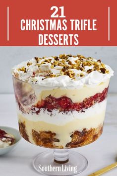 a trifle with whipped cream, fruit and nuts in it next to a spoon