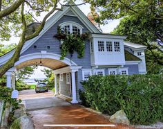 a car is parked in front of a blue house