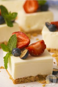 small desserts with strawberries and blueberries on top