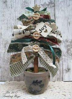 a potted plant with ribbon and buttons on it