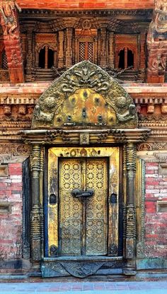 an old door with ornate carvings on the front and side of a building in india