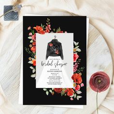 a black and white floral bridal shower card with an image of a bride's dress