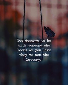 two butterflies hanging from strings with the words you deserves to be with someone who looks at you like they've won the lottery