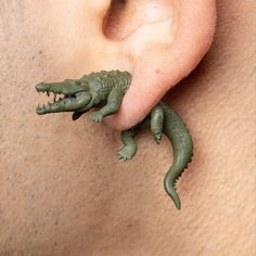 there are two alligators attached to the ear