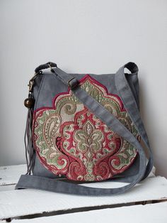 Gray oriental handbag, Vegan messenger bag, Medium sized bag, Oriental purse, Festival bag, Unique clothing accessory ,Gift idea, Vegan bag Very shapely bag that easily fits the most necessary little things. A beautiful addition to your bags collection. 🔴 Bag made of and vegan suede and jacquard, 🔴 Inside the bag will find a lining with two pockets. 🔴 Bag closed by magnetic snap. 🔴 For wearing on a shoulder or diagonally with adjustable, long strap. 🔴 The flap of the bag is decorated with a Handmade Hobo Crossbody Bag For Gifts, Handmade Hobo Crossbody Bag As Gift, Handmade Crossbody Hobo Bag As Gift, Bohemian Shoulder Canvas Bag For Gifts, Bohemian Canvas Shoulder Bag As Gift, Bohemian Canvas Shoulder Bag Gift, Bohemian Shoulder Canvas Bag, Vegan Bag, Medium Sized Bags