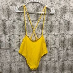 Zaful Yellow Jumper Style Swim Suit Bikini Bottoms High Waist Size Us 6 Nwt Very Good Condition See Pictures For Details And Measurements To Reduce Chance Of Returns. Please Note That Some Measurements May Be Different Than Size Tag Due To Washing And Stretching. All Items Come From A Smoke Fee Home. You Will Receive The Exact Item In The Picture. This Item Is In The Condition Stated In Our Listing. We Try Hard To Include As Many High-Quality Pictures As Possible. Any Known Defects Or Features W Summer Beachwear Bodysuit With Built-in Bra, Stretch T-back Summer Swimwear, Summer Swimming Bodysuit With Built-in Bra, Casual One-piece Swimwear With Built-in Bra, Solid Color Swimwear With Built-in Bra For Summer, Summer T-back Swimwear For Beach Season, Summer Vacation Bodysuit With Built-in Bra, Summer Bodysuit With Built-in Bra For Vacation, Sleeveless Strapped Swimwear For Beach Season