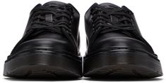 Low-top buffed leather sneakers in black. Round toe. Six-eye lace-up closure. Logo patch at tongue. Tonal signature treaded Air Cushion rubber sole. Tonal hardware. Supplier color: Black