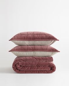 three pillows stacked on top of each other