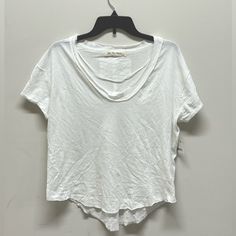 This Free People T-Shirt Is A Size Xs. White, Short Sleeve Shirt With A Scoop Neckline. Raw Cut Hemline And Neckline. Small Cuffed Sleeves. High Low Hemline. Seam Running Down The Back. This Shirt Is New With Tags. **There Is A Small Hole Near The Right Sleeve. This Is A Perfect Everyday Top To Go With Anything In Your Wardrobe. Casual White Scoop Neck Top, White Scoop Neck Top For Layering, White Scoop Neck Top For Everyday, White Relaxed Fit Short Sleeve Top With Scoop Neck, White Hand Dyed Short Sleeve T-shirt, Summer Free-spirited Short Sleeve T-shirt, Distressed White Short Sleeve T-shirt, White Patchwork Short Sleeve T-shirt, White Bohemian V-neck T-shirt