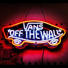 a neon sign that says vans off the wall