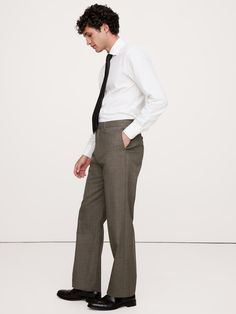 This sophisticated Italian wool suit pant is cut from a luxurious and historical wool fabric—one we love for its distinctive balance between an open weave and a tighter tension yarn, which gives it the ability to remain breathable while always looking pulled-together.  Breathable, Wrinkle-Resistant Tailored Straight Fit: High-rise with a straight leg.  Fabric from Italy's Vitale Barberis Canonico.  Zip fly with button-tab closure.  Front, back and ticket pockets.  Lined to the knee.  Tailored St Suit Pant, Open Weave, Wool Suit, Wool Fabric, Straight Leg Pants, New Woman, First Look, The Knee, Banana Republic