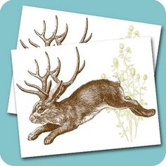 two greeting cards with an image of a deer leaping through the air and flowers in the background