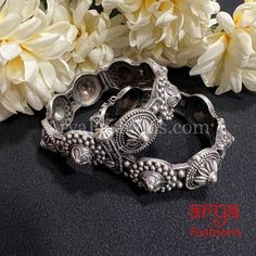 Rajasthani Gokhru Silver Oxidized Openable Bangles- Available Size: 2.6. Can fit size 2.8 due to openable feature.- Silver Oxidized Bracelet bangles in silver finish.- Very Elegant and stylish, these bangles can be paired with any Attire depending upon the occasion and the theme. - The base is pure brass (90%) and pure 92.5 silver (10%) which makes this very sturdy and of good quality. - 100% guarantee on the finish- it will not lose its finish/color/shine. - Very lightweight and Handcarved.- Op Luxury Traditional Oxidized Bangle, Silver Temple Jewelry Bangle For Rituals, Antique Silver Metal Bangle For Wedding, Antique Silver Bangle For Wedding, Silver Openable Temple Jewelry, Silver Oxidized Finish Bangle For Weddings, Silver Openable Bangle For Festivals, Silver Fusion Style Bangle For Festive Occasions, Ceremonial Silver Openable Bangle