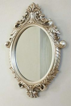 an ornate mirror hanging on the wall