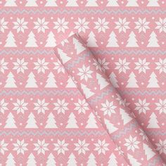 a pink and white fabric with snowflakes on it