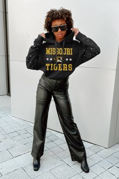 Show your Missouri Tigers pride in style with our long sleeve hoodie, complete with a scrunch waistband and dazzling rhinestone details. Crafted for softness and durability, this hoodie is the perfect addition to your gameday wardrobe whether you're cheering at the stadium or strolling the streets. Kansas State Wildcats, Washington State Cougars, Texas Tech Red Raiders, Indiana Hoosiers, Red Raiders, Usc Trojans, Louisville Cardinals, Cincinnati Bearcats, Arkansas Razorbacks