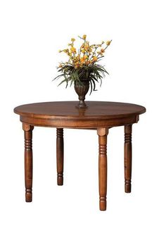 a wooden table with a vase on top and flowers in the middle, against a white background