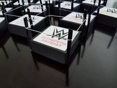 a group of black and white boxes sitting on top of a table