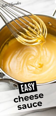 a whisk is being used to stir cheese sauce in a pan with the words easy cheese sauce on it