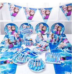 frozen princess party supplies including plates, napkins and decorations