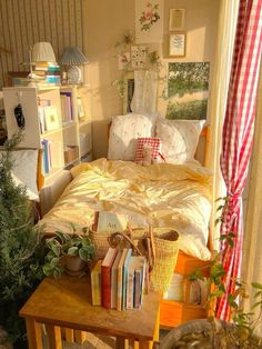 a bed room with a neatly made bed and lots of books on top of it