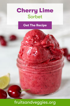 cherry lime sorbet in a small jar with cherries around it and the text, get the recipe