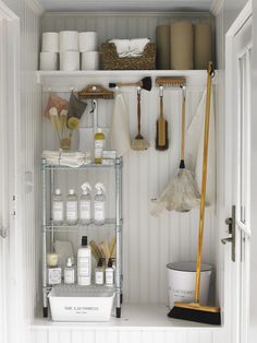 an organized bathroom closet with toiletries, cleaning supplies and other household care products on shelves