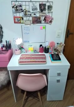 a white desk topped with a pink chair