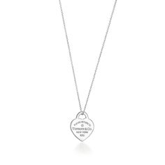 Inspired by a key ring we debuted in 1969, the Return to Tiffany collection is famous for its signature motif. This pendant reinvents the classic by setting a diamond in the iconic heart tag. Style with other delicate necklaces for a perfectly layered look. Sterling silver with a round brilliant diamond; Motif size, small; On an adjustable 16-18" chain; Carat weight .01 | Return to Tiffany® Heart Tag Pendant in Sterling Silver with a Diamond, Small Tiffany And Co Pendant, Tiffany Tag Necklace, Tiffany And Co Heart Tag Necklace, Tiffany And Co Silver Jewelry, Tiffany Pendant Necklace, Tiffany And Co Return To Tiffany, Tiffany Return To Tiffany Necklace, Tifanny Necklace, Tiffany And Co Necklace Heart