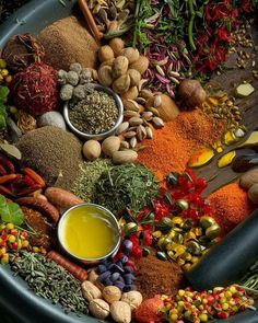 an assortment of spices and condiments in a bowl