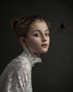 a woman in a white dress with a butterfly flying over her head and the caption says, i am not sure what this image is