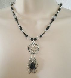 "Black Pentacle Necklace This lovely necklace has black glass pearl beads, black glass beads, seed beads, clear faceted beads, sterling silver plated bead caps, silver foil beads, pewter silver pentacle and black glass drop with metal chain. 18\" long. Toggle clasp." Goddess Witchcraft, Pentacle Necklace, Witchcraft Magic, Wicca Jewelry, Pagan Necklace, Wiccan Necklace, Magic Witch, New Plymouth, Wiccan Jewelry