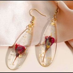 Red Rose Pressed Preserved Dried Flower Floral Gold Flakes Flecks Teardrop Transparent/Clear Feminine Romantic Dangle Earrings. Gorgeous Dried Little Red Roses Complete With Stems And Leaves Preserved In Clear Epoxy Resin With Delicate Gold Flakes/Flecks. Elongated Teardrop Shaped Dangles. A Beautiful Feminine & Romantic Gift For Valentine’s/Anniversary/Birthday/Etc. Or Treat Yourself! New. Measurements: Eardrop Length: 3.1” Earring Width: 0.8” If You Want It, Don’t Let It Get Away Send Me An Of Straw Earrings, Wedding Earrings Studs, Handmade Mermaid, Gold Bead Earrings, Wedding Studs, Romantic Earrings, Gift For Valentine, Feminine Romantic, Clear Epoxy Resin