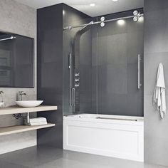 a bathroom with a sink, mirror and bathtub next to shelves on the wall