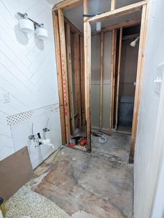 the bathroom is being remodeled and ready to be used as a shower room or mud room