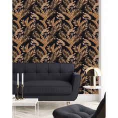 a living room with black and gold wallpaper