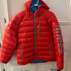 Questions? Leave A Comment Below! Sporty Red Outerwear With Detachable Hood, Casual Red Outerwear For Winter Sports, Red Hooded Puffer Jacket With Pockets, Sporty Red Hooded Puffer Jacket, Red Outerwear For Winter Sports, Red Winter Sports Outerwear, Casual Red Down Outerwear, Red Hooded Puffer Jacket With Detachable Hood, Red Hooded Jacket With Pockets For Cold Weather