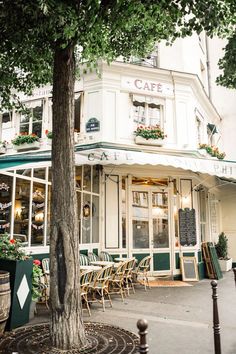 an outside view of a restaurant with tables and chairs