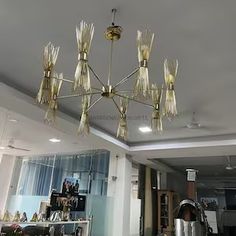 a chandelier hanging from the ceiling in a living room