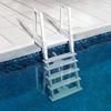 two white steps sitting on top of a swimming pool